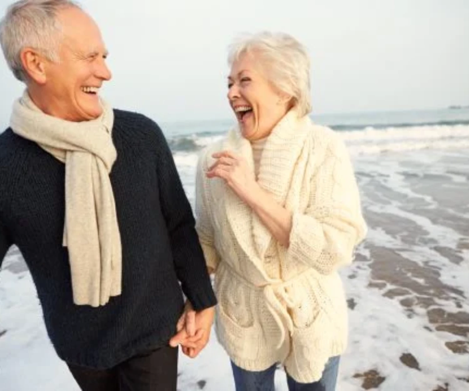 Senior couple at the beach - hear well be well